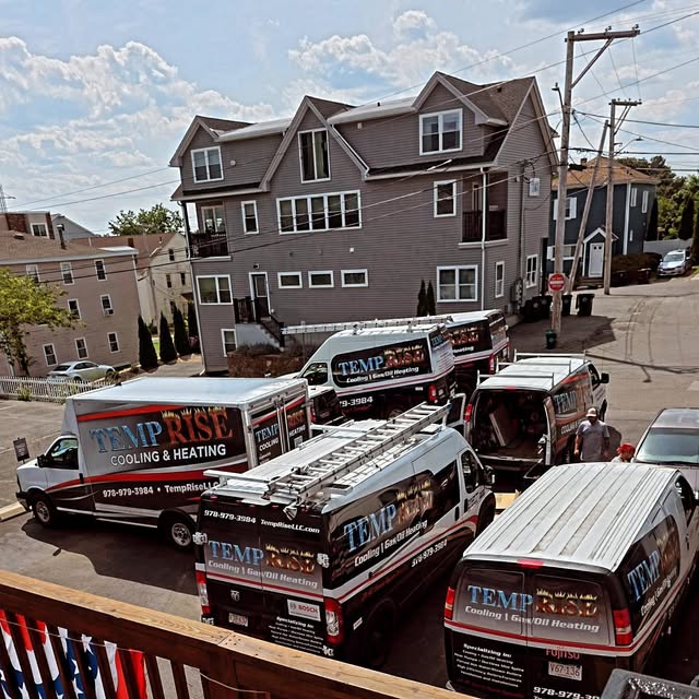 Temp Rise's fleet of service vans staged outside a Beverly job site